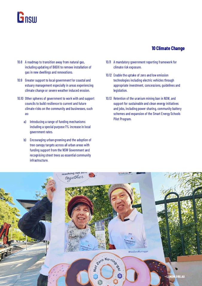 A person and person holding a sign

Description automatically generated