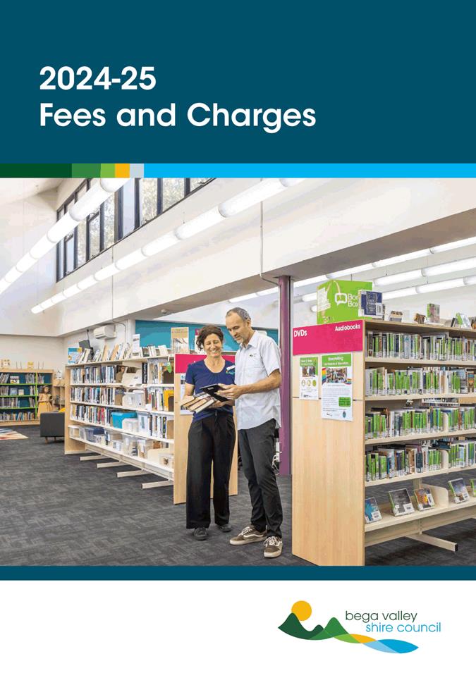 A person and person standing in a library

Description automatically generated