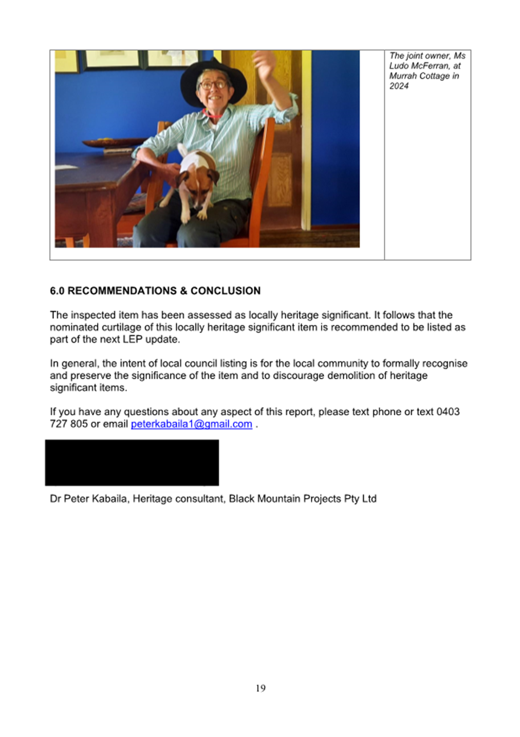 A person sitting in a chair with a dog

Description automatically generated