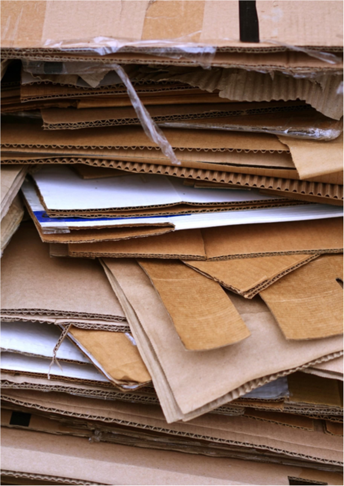 A pile of cardboards stacked on top of each other

Description automatically generated
