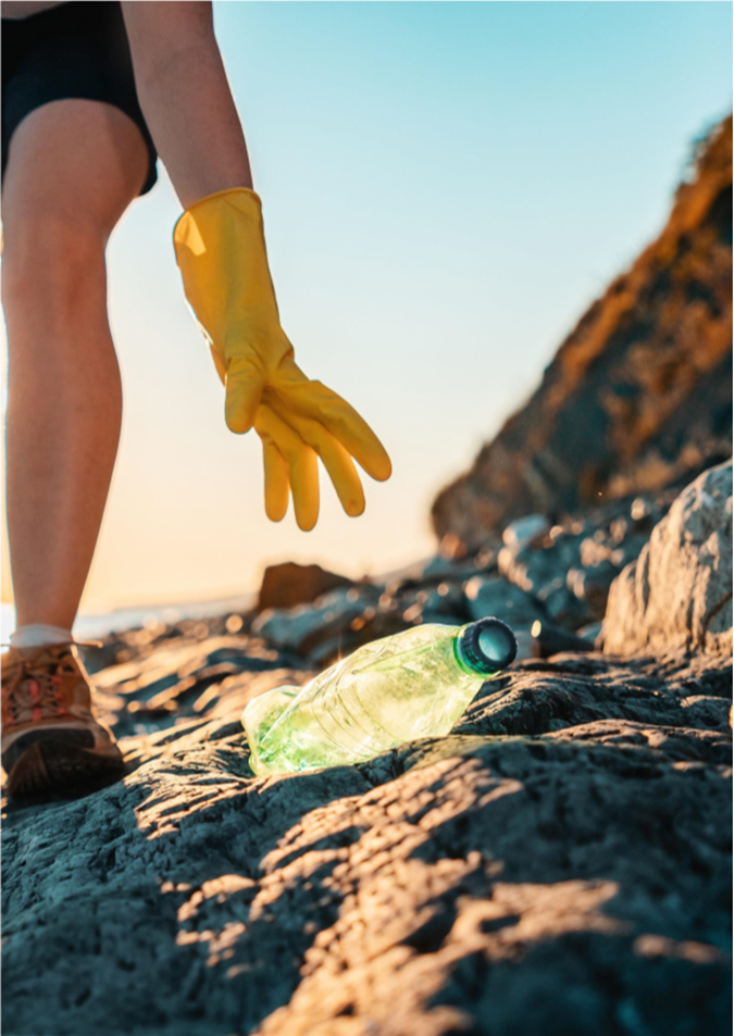 A person wearing gloves reaching for a plastic bottle

AI-generated content may be incorrect.