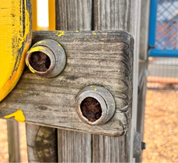 A wood post with two holes

AI-generated content may be incorrect.
