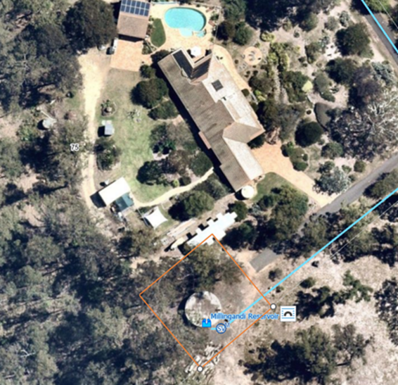 An aerial view of a house with a pool and trees

AI-generated content may be incorrect.